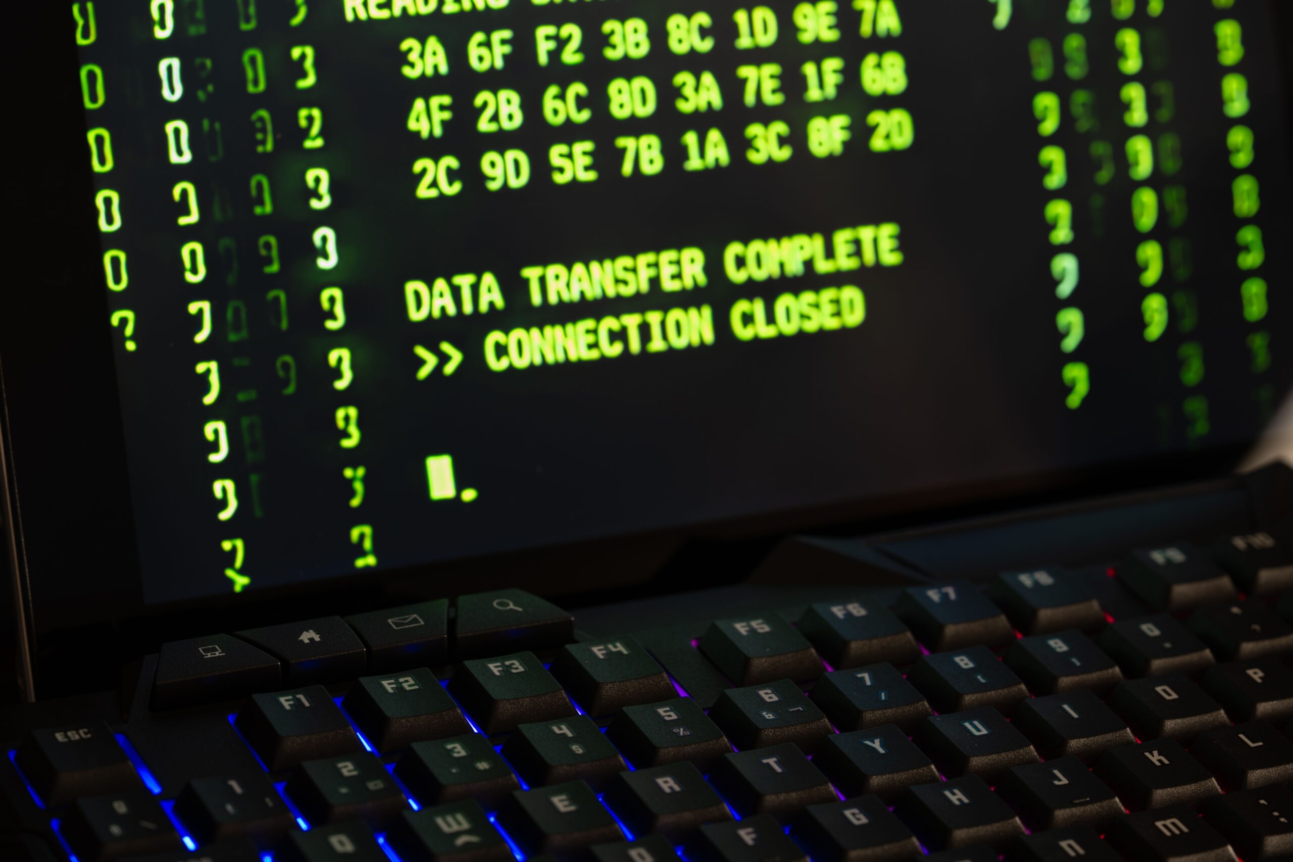 a computer screen, containing mainly only green numbers with text at the bottom that says 'transfer complete, connection closed'